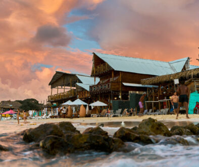 Wooden beach bar in the evening light by the water