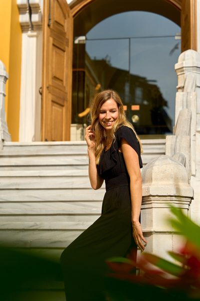 Janet on the marble staircase of a historic building, Türkiye